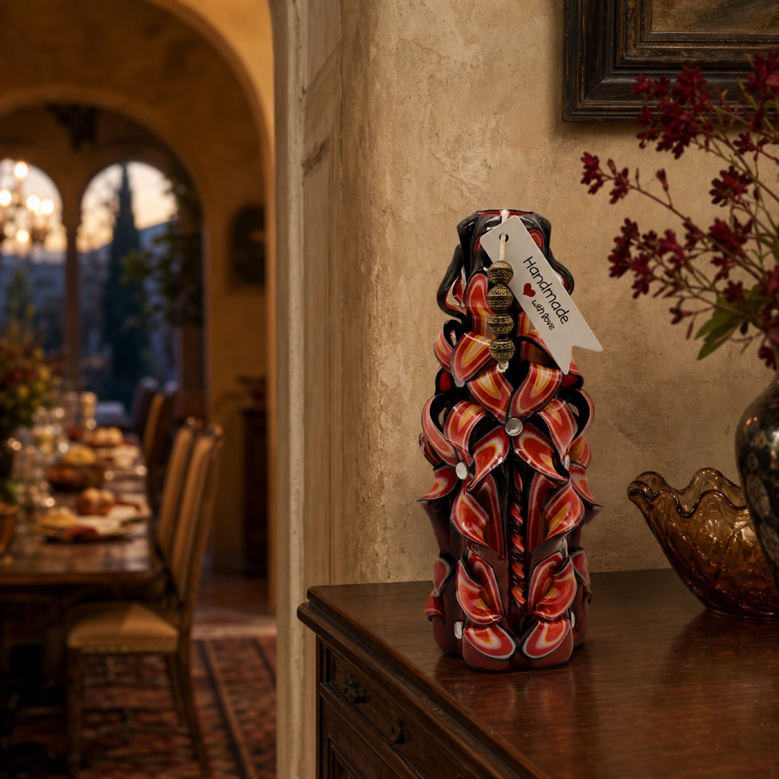 An original Crimson Ember Noir carved candle